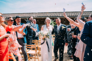 Couple celebrating their wedding at East Sussex wedding venue Rathfinney Estate